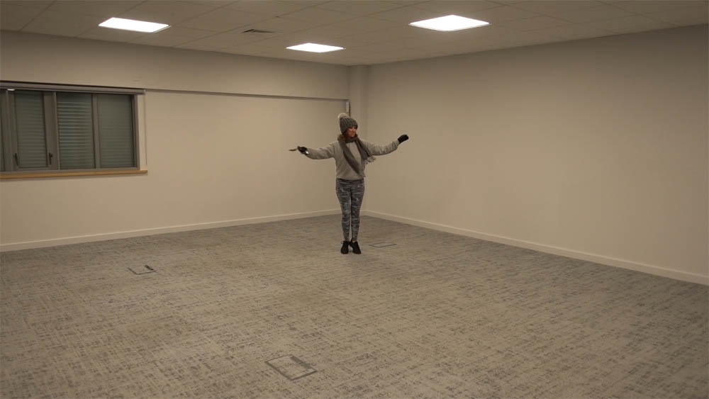 Emma standing where the threshold to the cryotherapy chamber will be