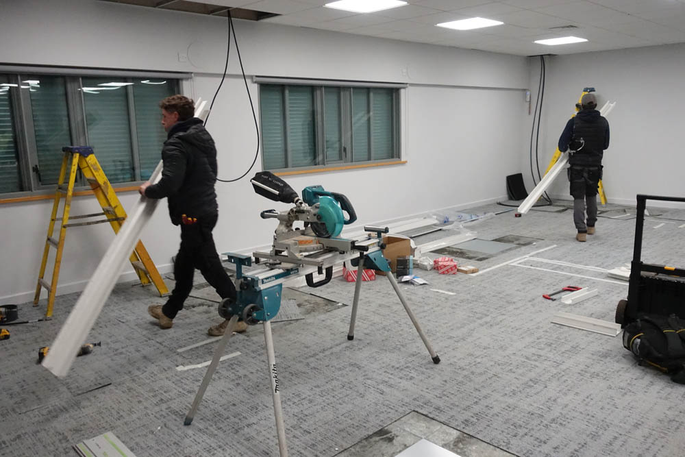 The electricians, trunks in hand