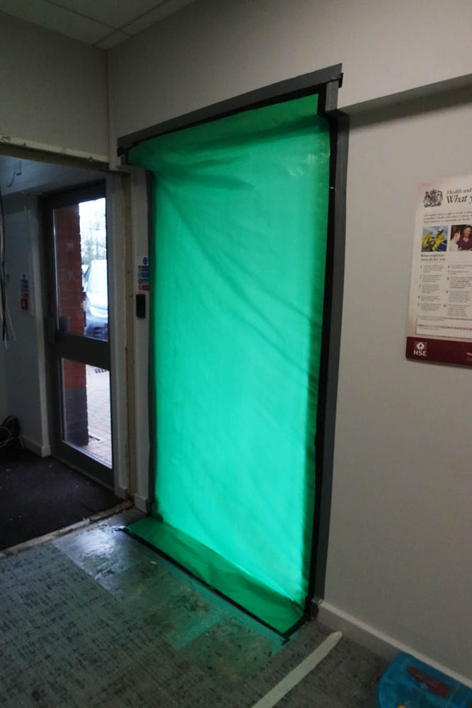 We did fill the gap with lovely green plastic - the steel roller shutters will provide more than adequate security