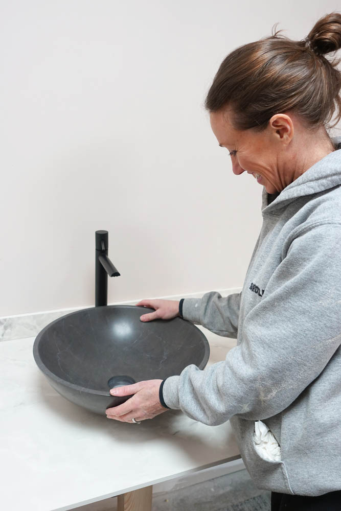 Emma's clearly very pleased with her marble bowl and black tap