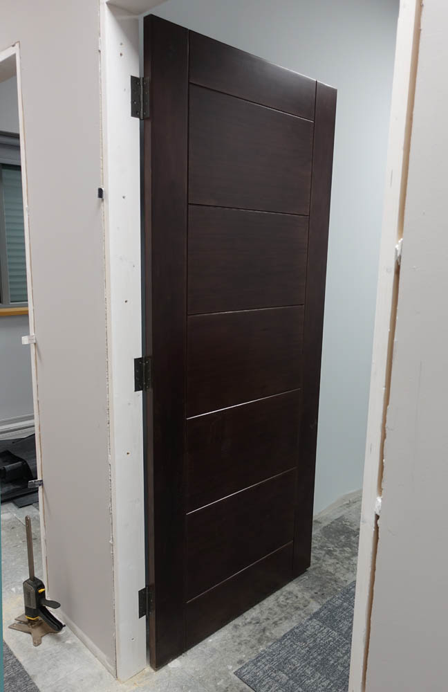 The walnut doors that lead to the red light rooms
