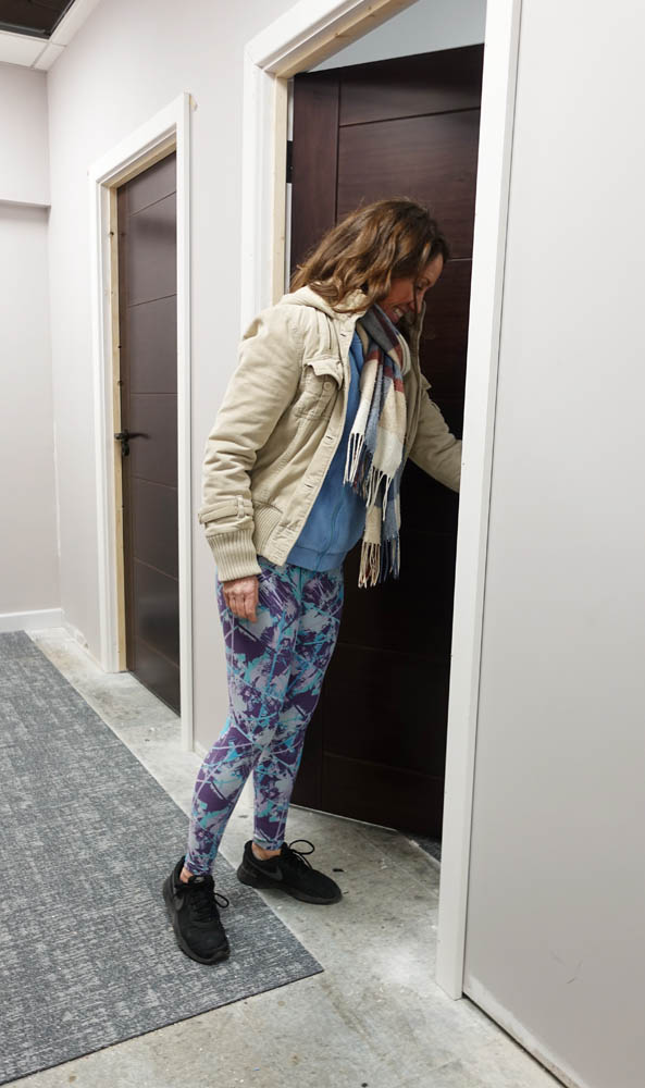Emma tries the doors to the red light therapy rooms