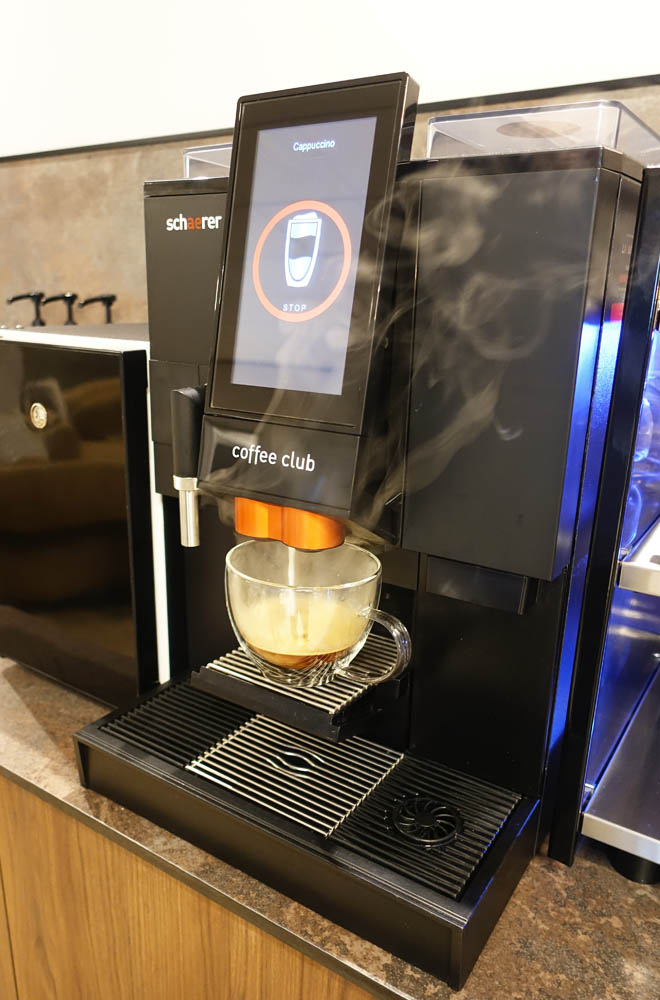 A steaming cappuccino on the way